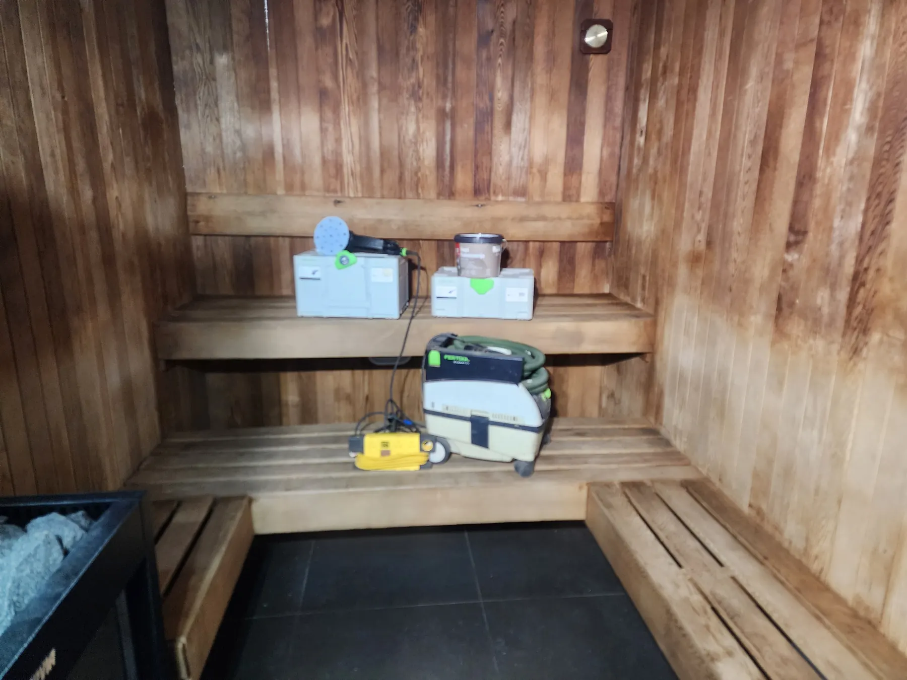 Festool sander, dust extractor and supplies set up in the sauna