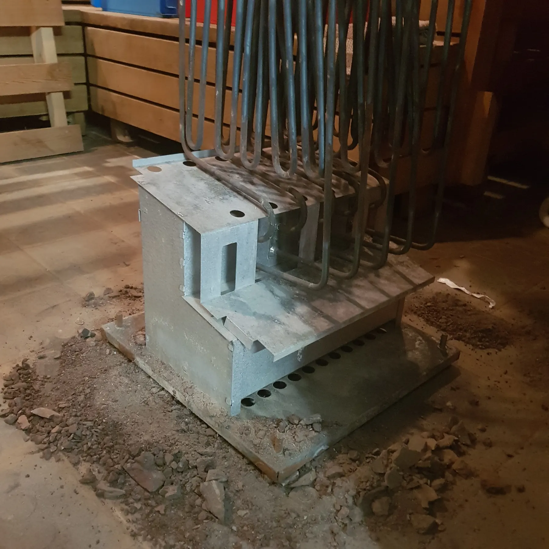 Heater elements removed, with crumbled stone debris underneath